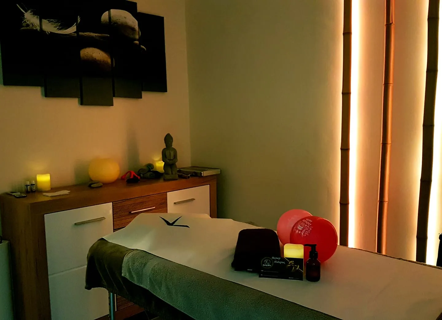 Massage room at Healing Hands Studio with candles and a warm atmosphere